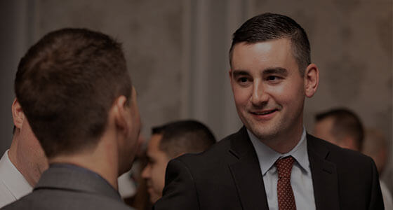 business men talking at networking event