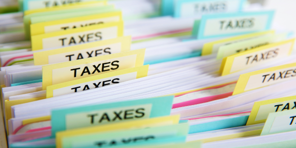tax records in cabinet, with labels that read "TAXES"
