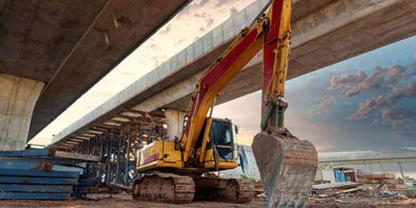 davis-bacon act compliance graphic, including construction vehicle working