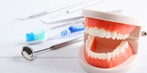 teeth with various dental instruments