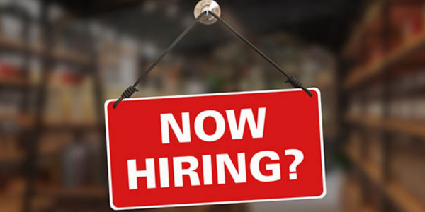 "Now Hiring" sign indicated for potential new nonprofit staff