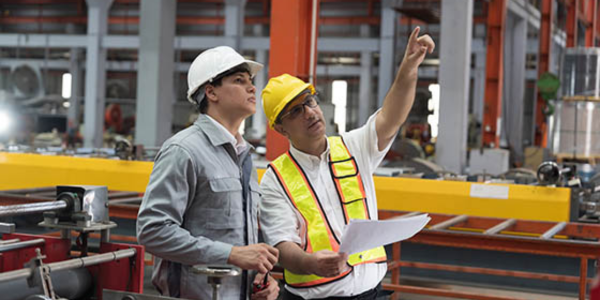 two construction workers in construction zone