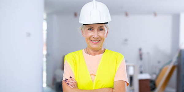 construction contractor in uniform with arms crossed