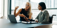 sole proprietors in a meeting about tax essentials