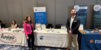 harlene stevens and jake forestiere in front of nisivoccia exhibition at njda annual convention
